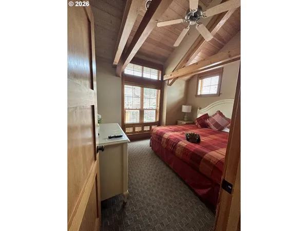 a bed room with a bed and a window