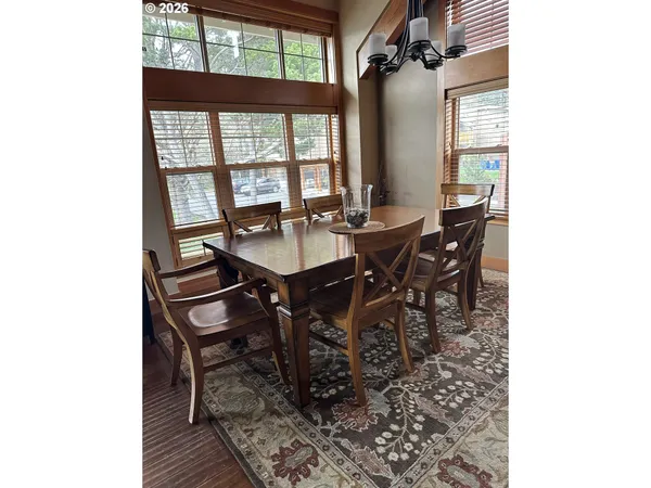 a view of a dining room with furniture and window