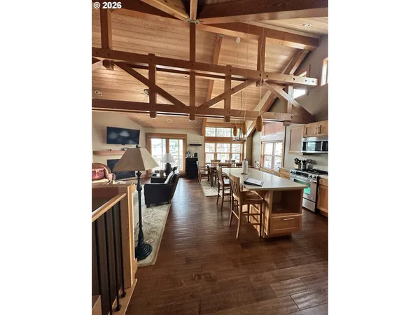 a dining room with lots of wooden furniture