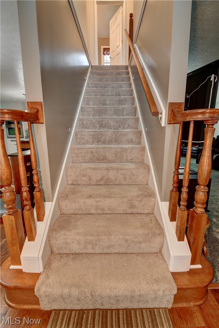 4301 Murray Road Dover, OH 44622 - Photo 22 of 49 Staircase with carpet