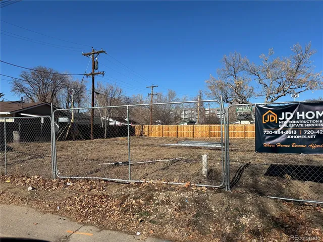 a view of a park with iron fence