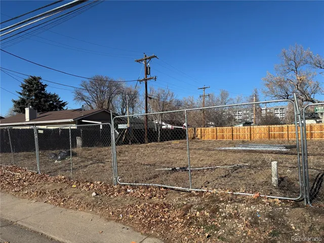 a street view with wooden fence