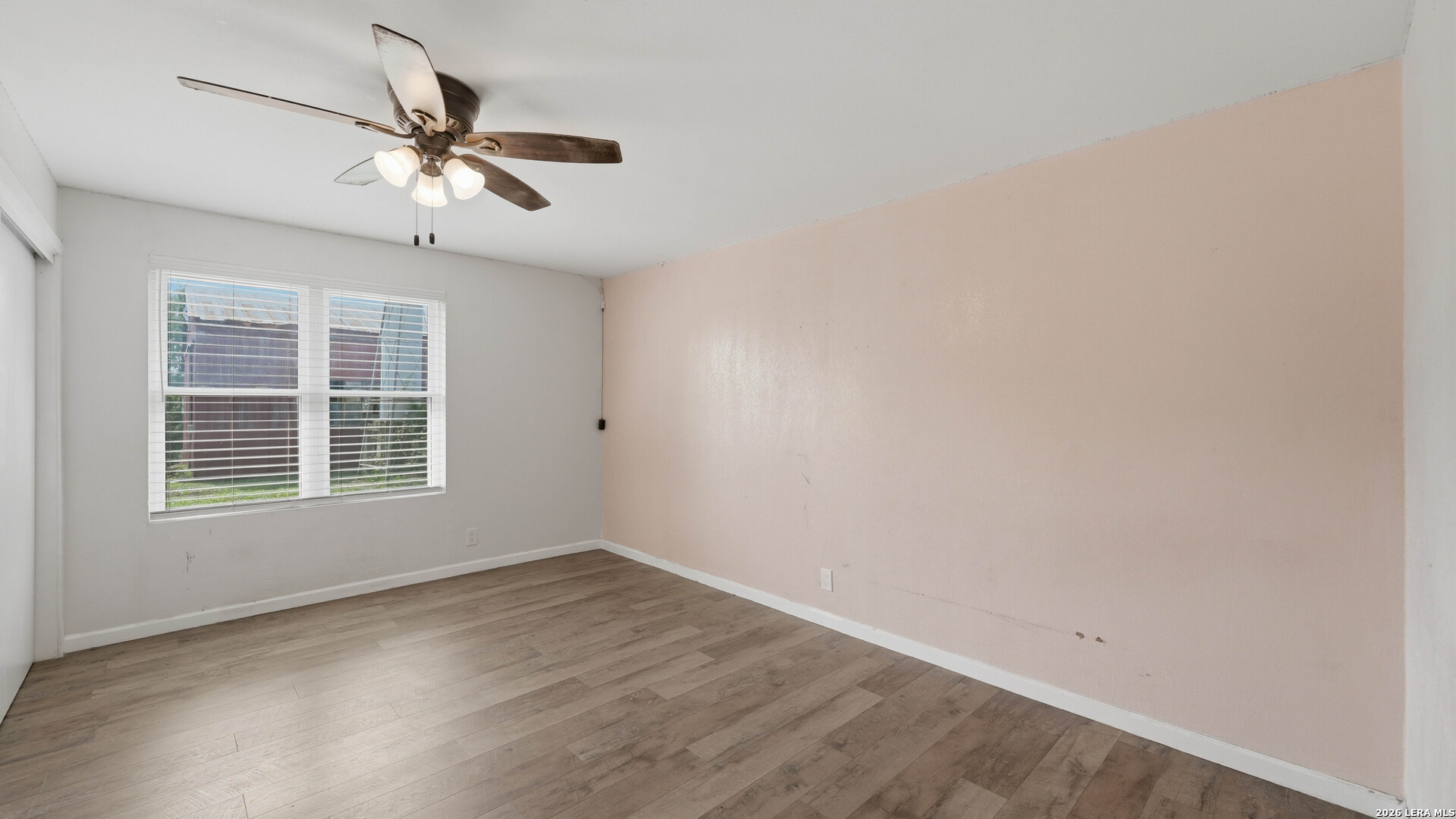 106 County Road 6611 Devine, TX 78016 - Photo 17 of 29 a view of empty room with wooden floor and fan