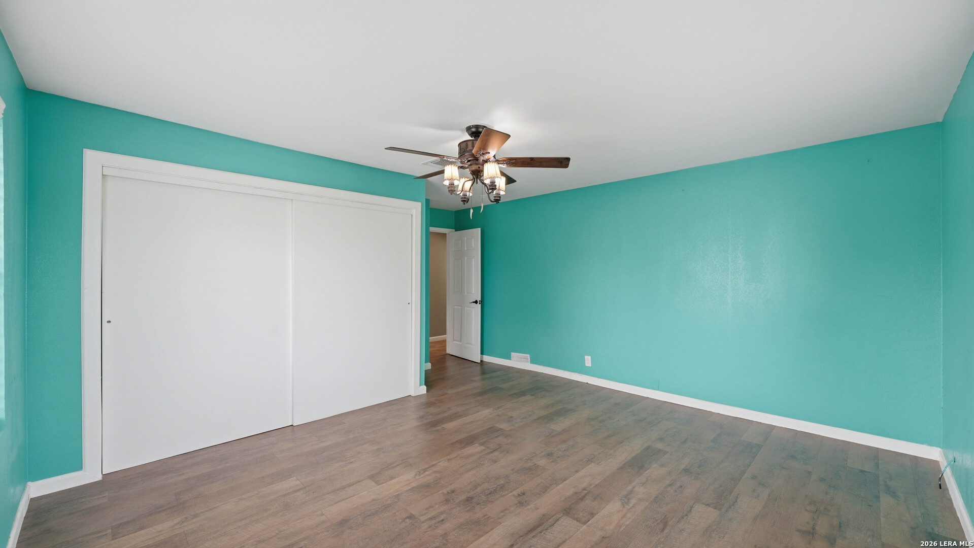 106 County Road 6611 Devine, TX 78016 - Photo 18 of 29 a view of empty room with wooden floor
