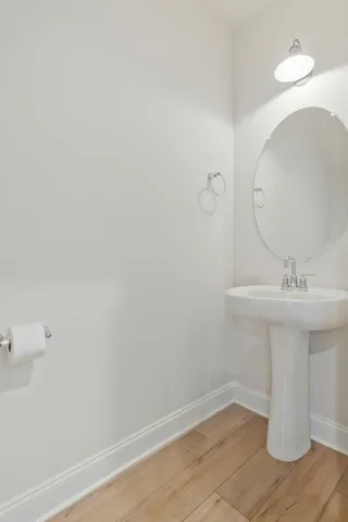 a bathroom with a sink and mirror