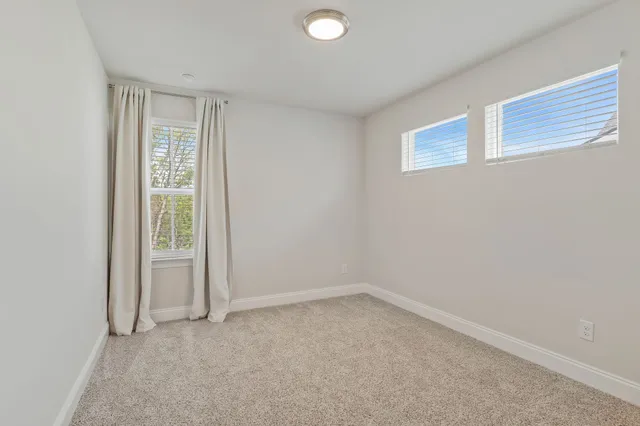 a bathroom with a sink toilet vanity and shower