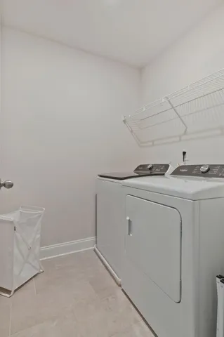 a bathroom with a shower sink vanity and mirror