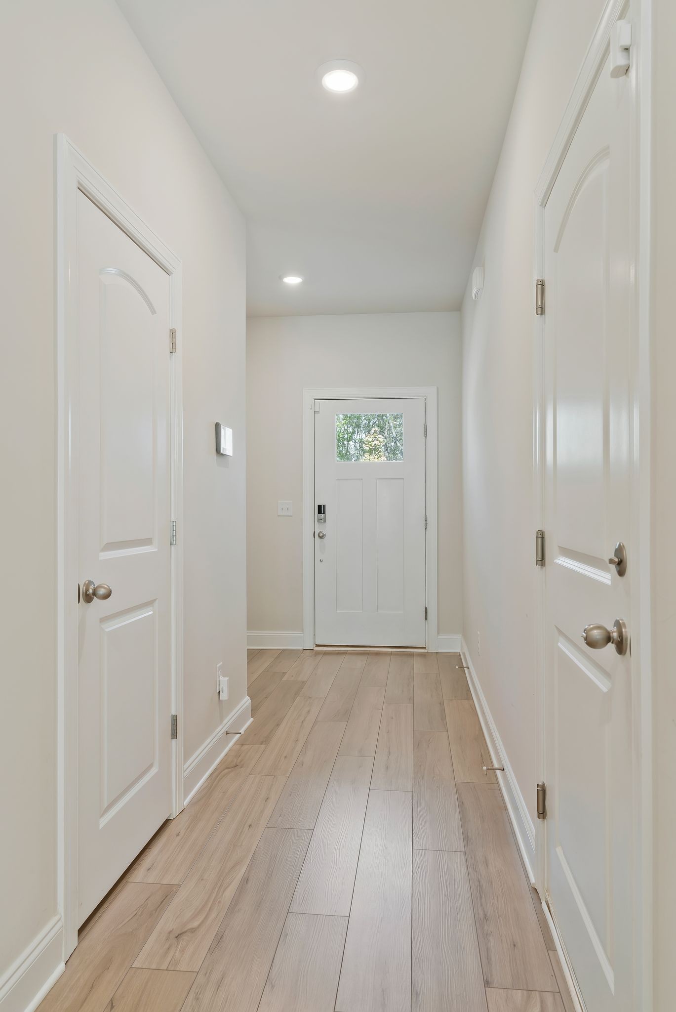 4669 Ridge Bend Drive Nashville, TN 37207 - Photo 6 of 33 a view of a hallway with wooden floor and a bathroom