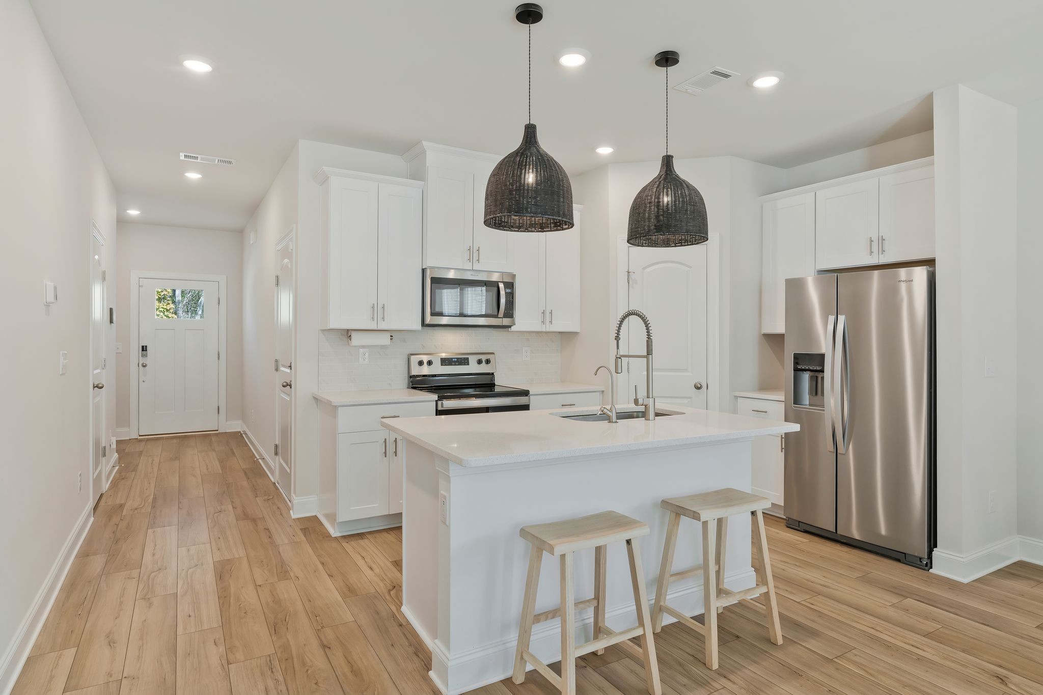 4669 Ridge Bend Drive Nashville, TN 37207 - Photo 8 of 33 a kitchen with stainless steel appliances granite countertop a sink a stove a refrigerator and island with wooden floor