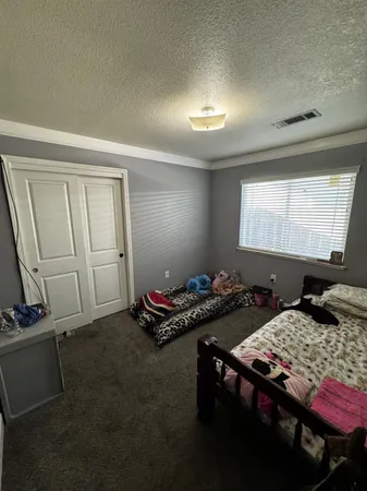 a room with furniture and musical instruments