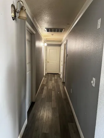 a bed sitting in a room next to a window