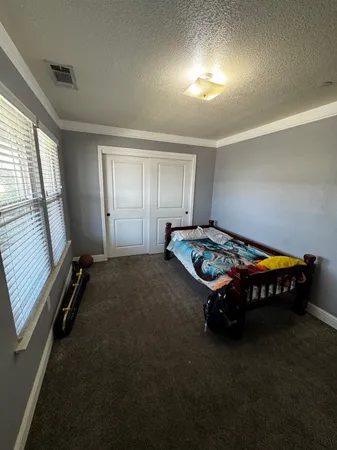 a bed room with furniture and a window