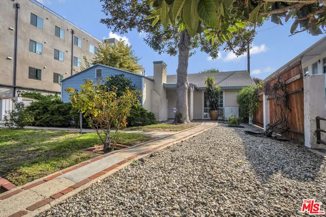 an aerial view of houses with outdoor space