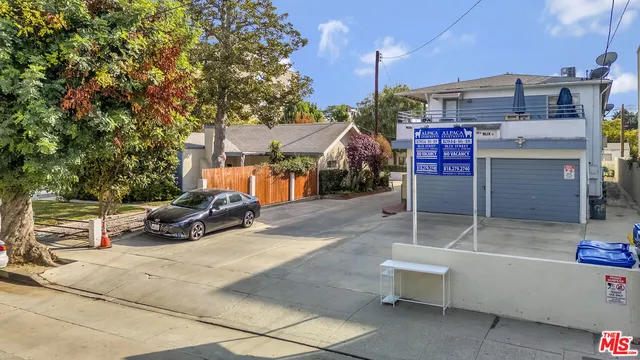 a view of a house with a yard and garage