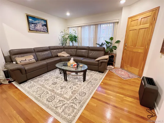 a living room with furniture and a rug