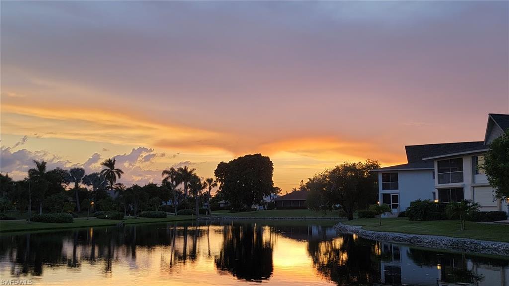 91 Georgetown Boulevard, Unit 91 Naples, FL 34112 - Photo 2 of 22 Sunset in the Western Sky View From Living Room