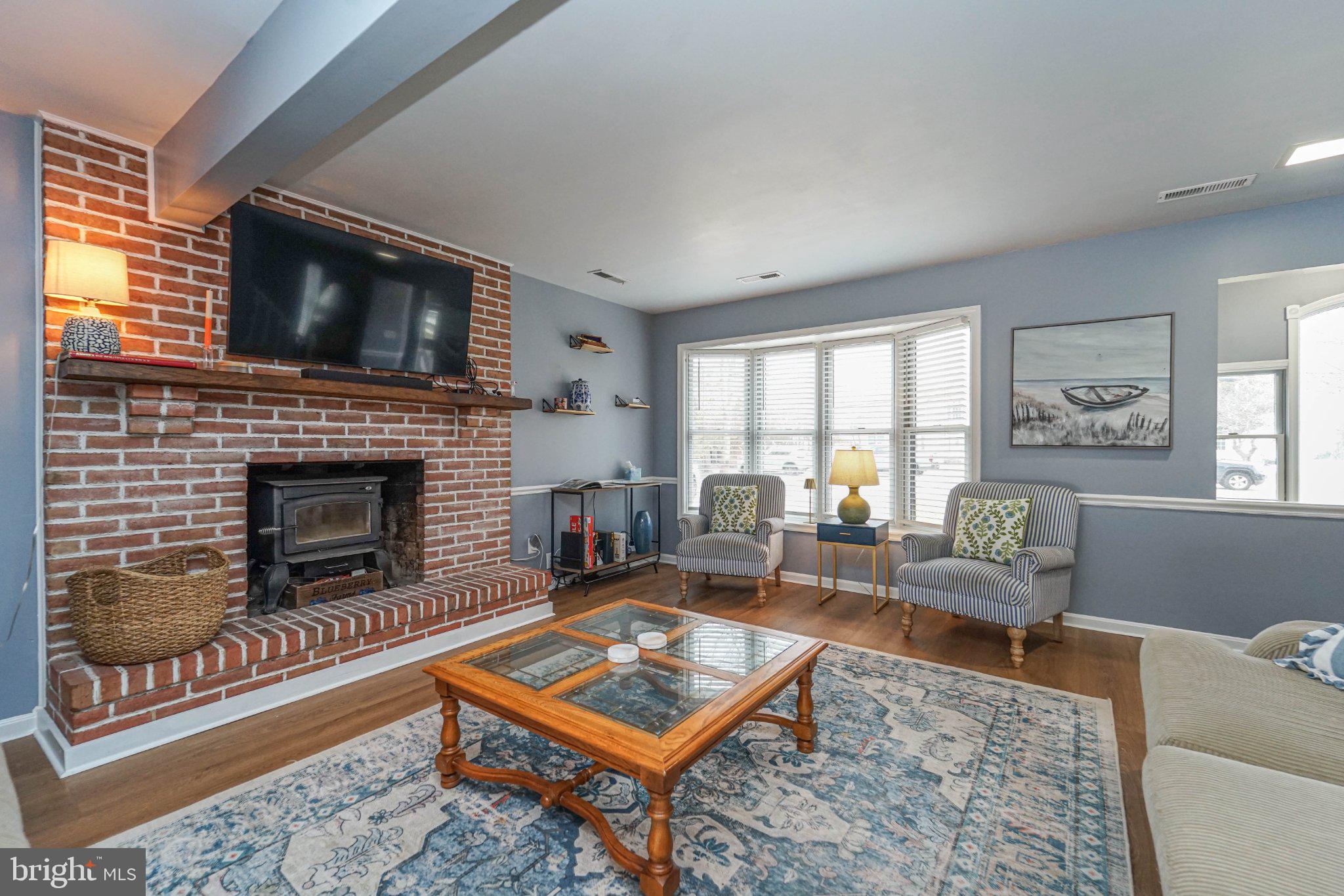 211 Queen Anne Road Stevensville, MD 21666 - Photo 4 of 33 Cozy living space with rustic charm.