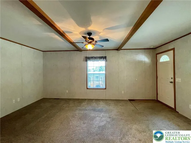 a kitchen with granite countertop a refrigerator stove top oven and sink