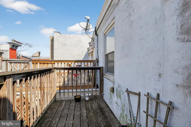 a view of balcony with wooden floor