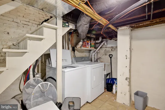 a view of storage and utility room with stairs