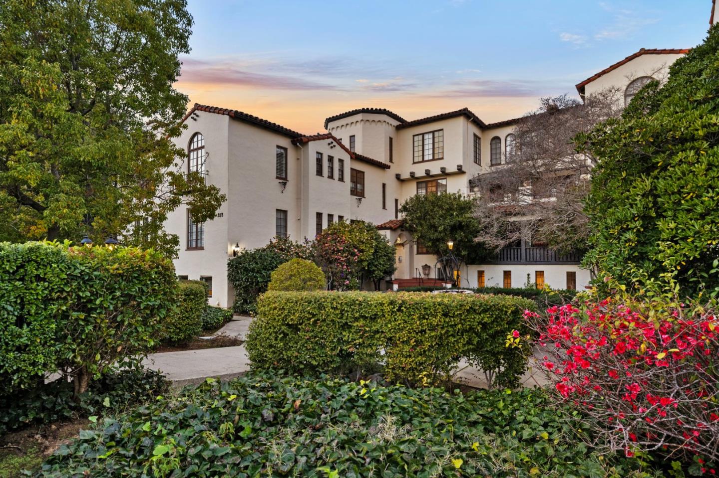 212 Eaton Road, Unit 12 San Mateo, CA 94402 - Photo 1 of 1 a front view of a house with a yard and flower plants
