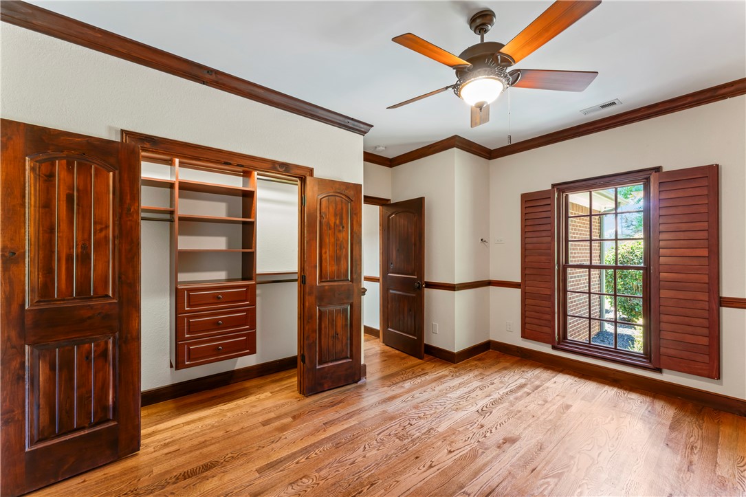579 Terrapin Crossing Road Pickens, SC 29671 - Photo 27 of 50 Custom knotty alder wood doors, built-in closet organization, and rich wood flooring elevate this welcoming bedroom.