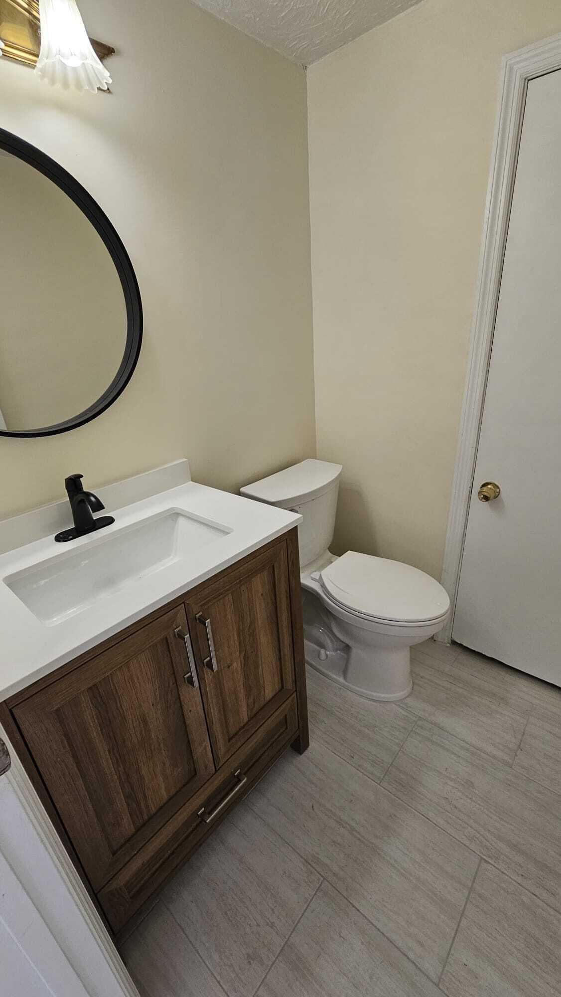 8801 West Sample Road, Unit 11 Coral Springs, FL 33065 - Photo 9 of 25 HALF BATH _8801 SAMPLE RD