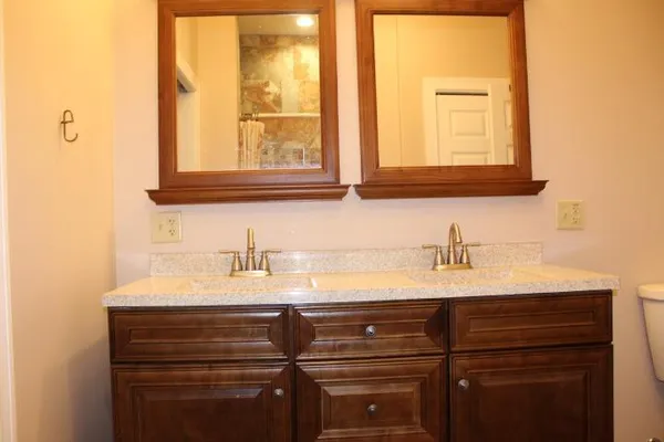 a bathroom with a sink and a mirror