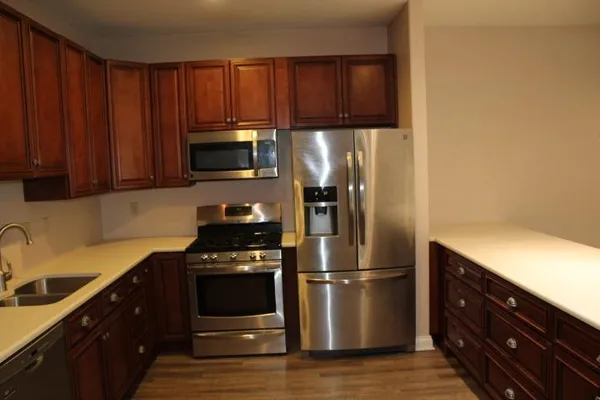 a kitchen with a stove microwave and refrigerator