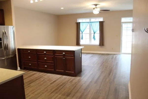 a room with a window and a wooden floor