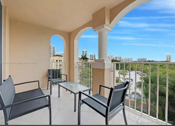 a view of a balcony with chairs