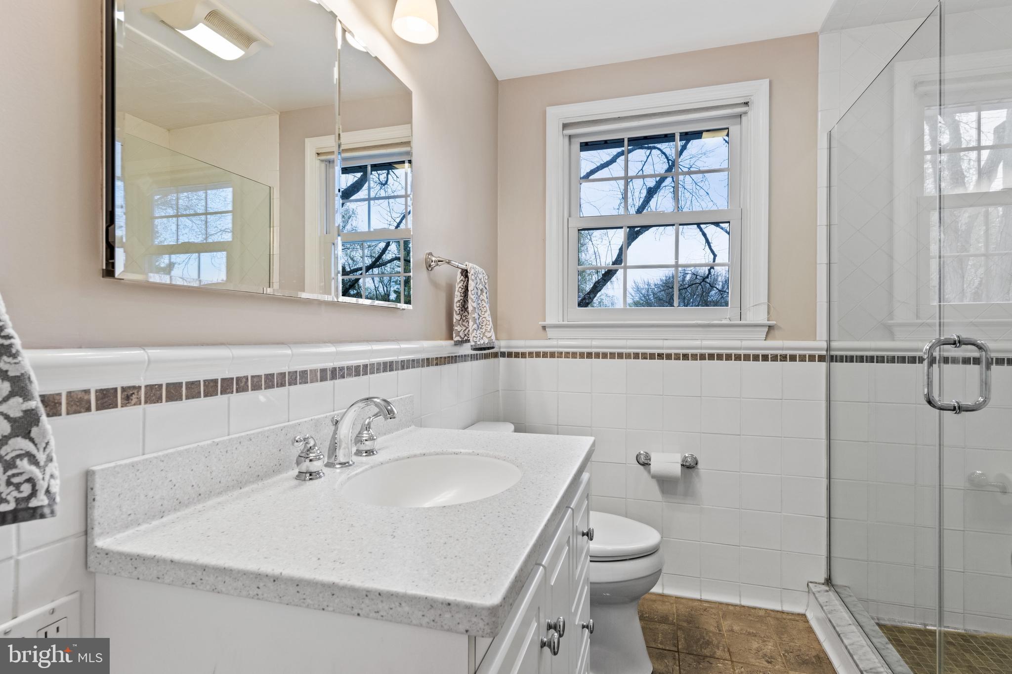 392 Yorkshire Road Bryn Mawr, PA 19010 - Photo 28 of 35 Renovated Hall Bath with frameless glass shower