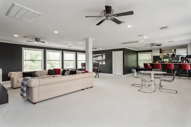 a living room with furniture and window