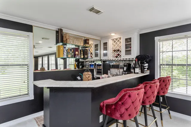 a view of a dining room with furniture and window