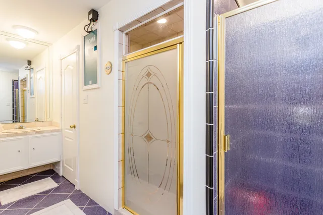 a bathroom with a bathtub and a shower