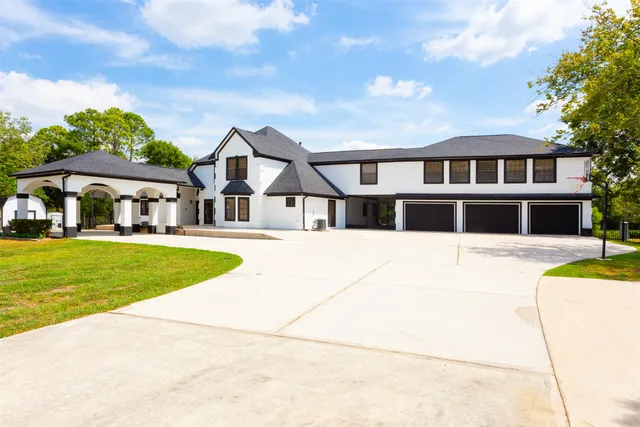 a house with swimming pool in front of it