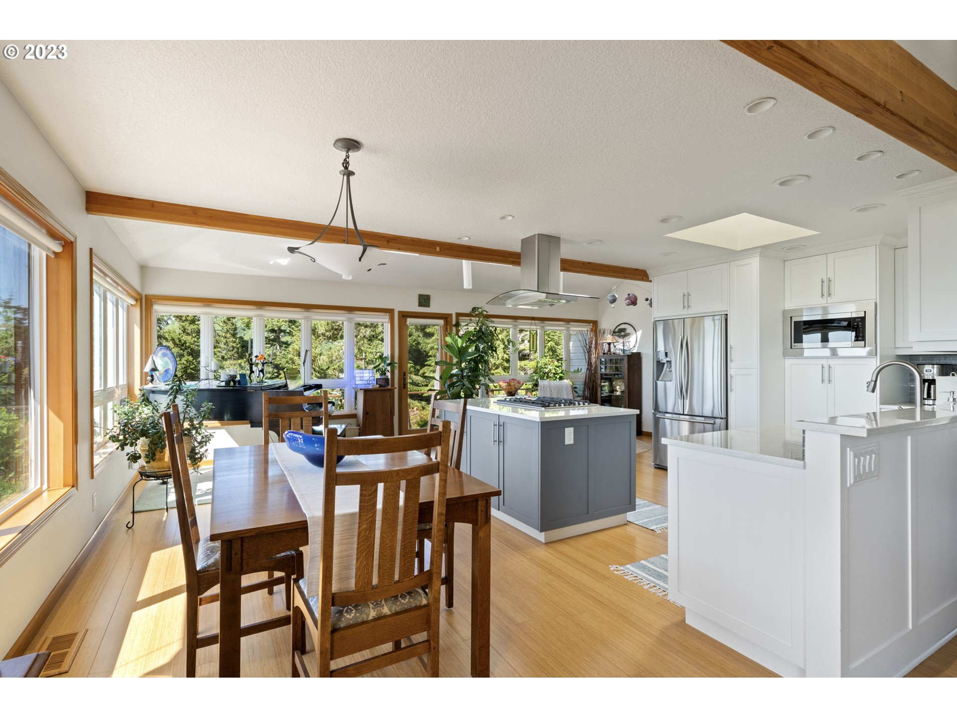 905 Pinewood West Tillamook, OR 97141 - Photo 11 of 44 a view of a dining room with furniture window and outside view