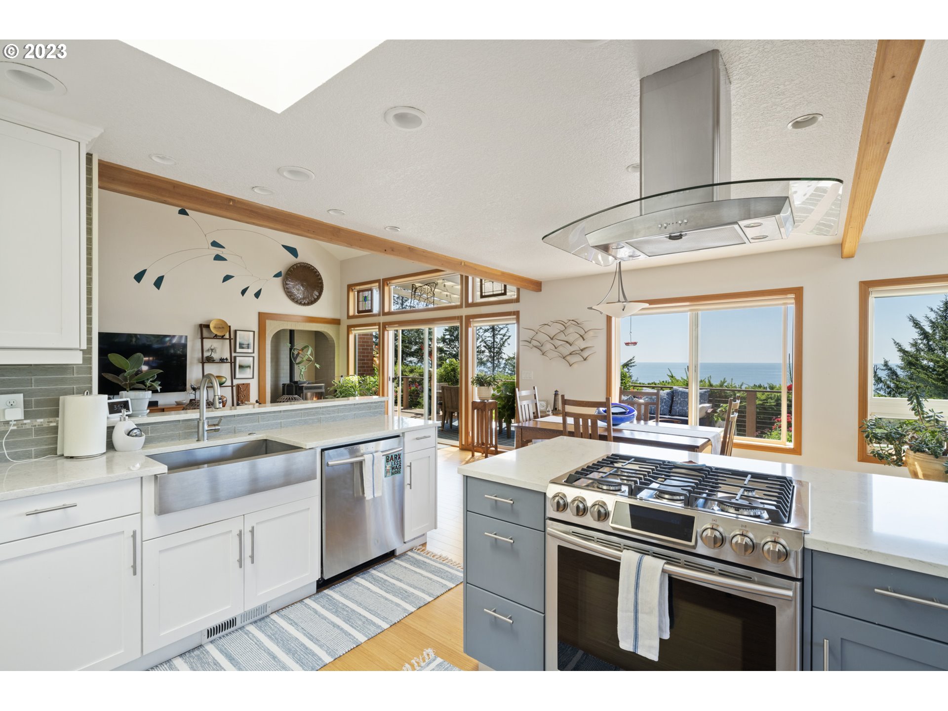905 Pinewood West Tillamook, OR 97141 - Photo 14 of 44 a kitchen with stainless steel appliances granite countertop a stove and cabinets
