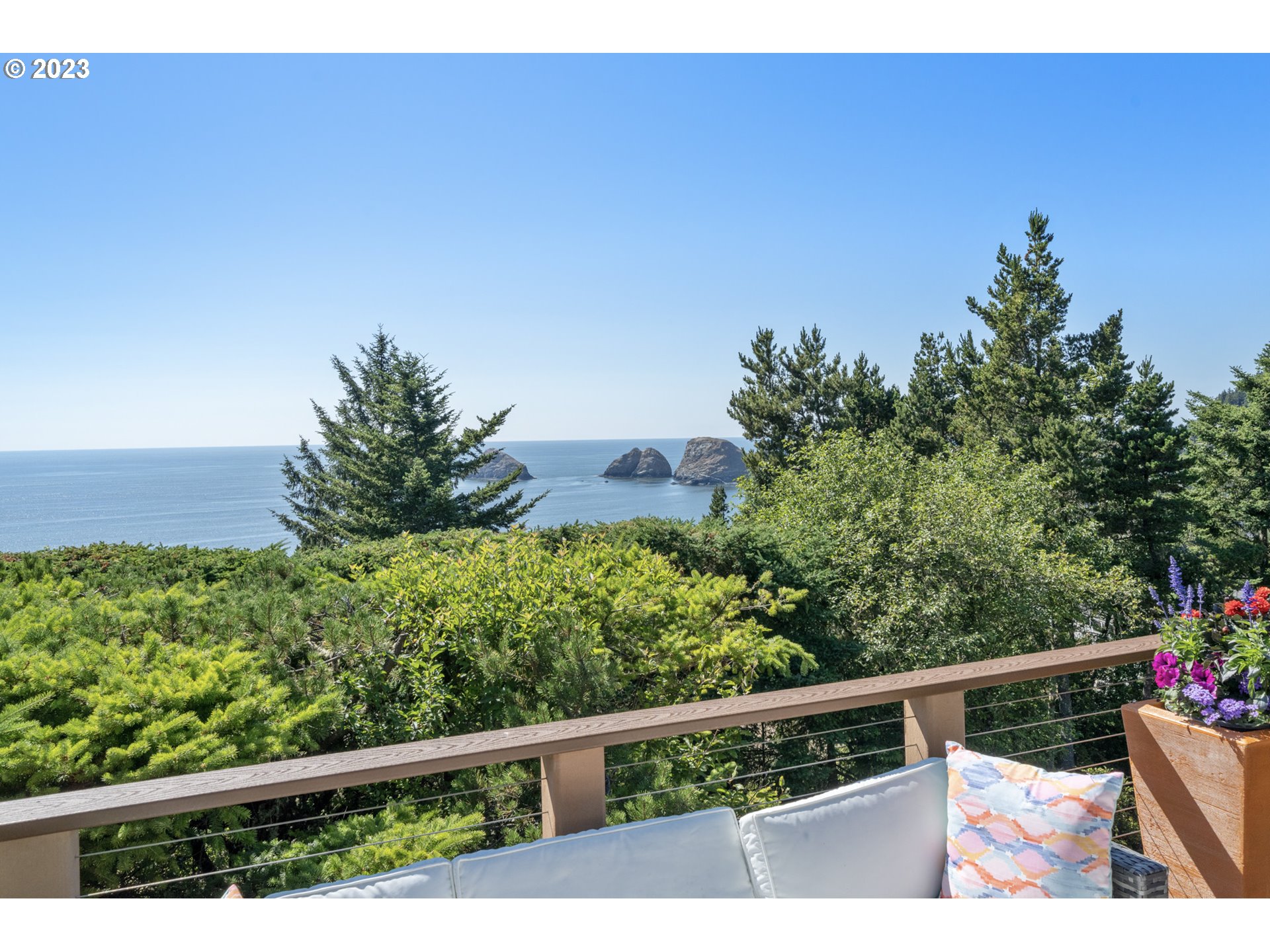 905 Pinewood West Tillamook, OR 97141 - Photo 25 of 44 a view of a balcony with flower plants