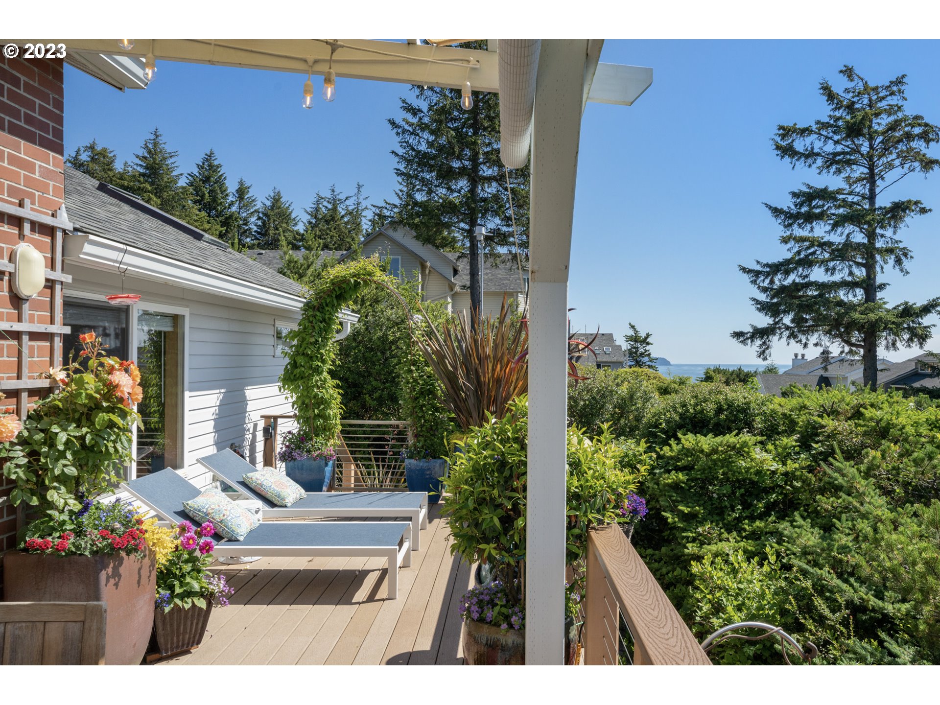 905 Pinewood West Tillamook, OR 97141 - Photo 28 of 44 a view of a house with a garden