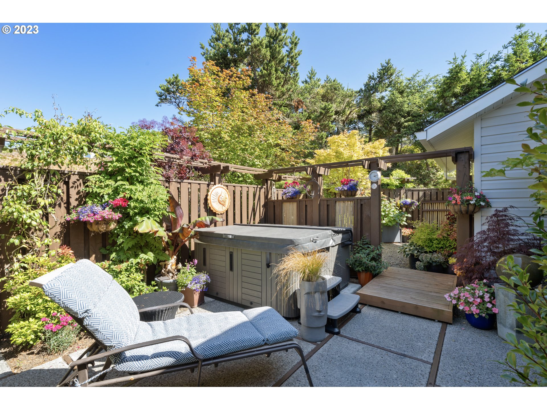 905 Pinewood West Tillamook, OR 97141 - Photo 29 of 44 a view of a chairs and table in the back yard of the house