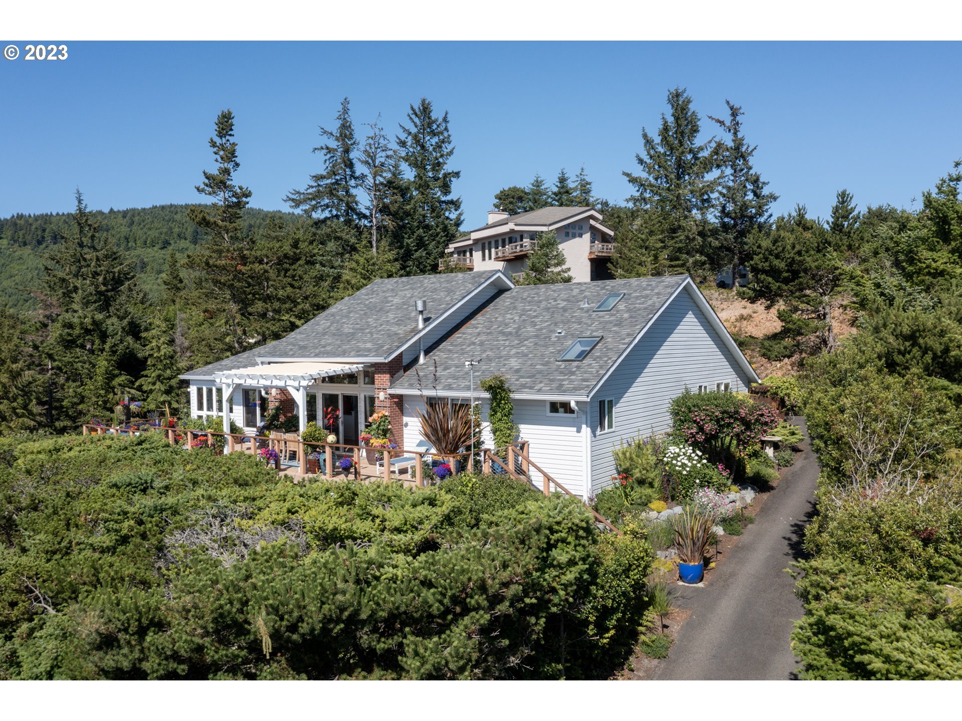 905 Pinewood West Tillamook, OR 97141 - Photo 32 of 44 an aerial view of a house with a yard