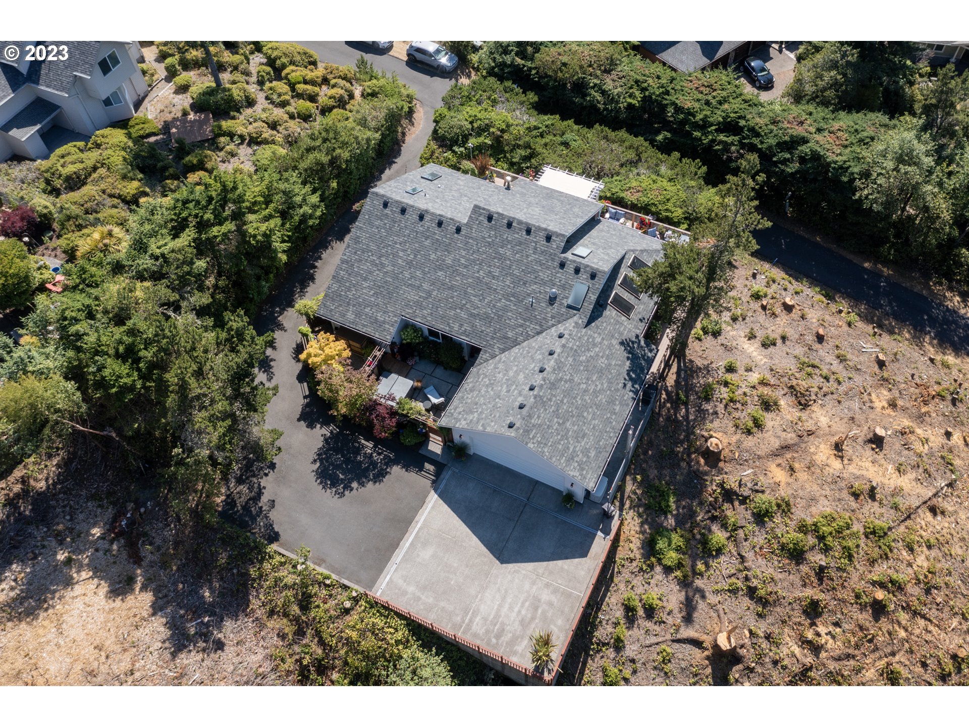 905 Pinewood West Tillamook, OR 97141 - Photo 37 of 44 an aerial view of a house with a yard basket ball court