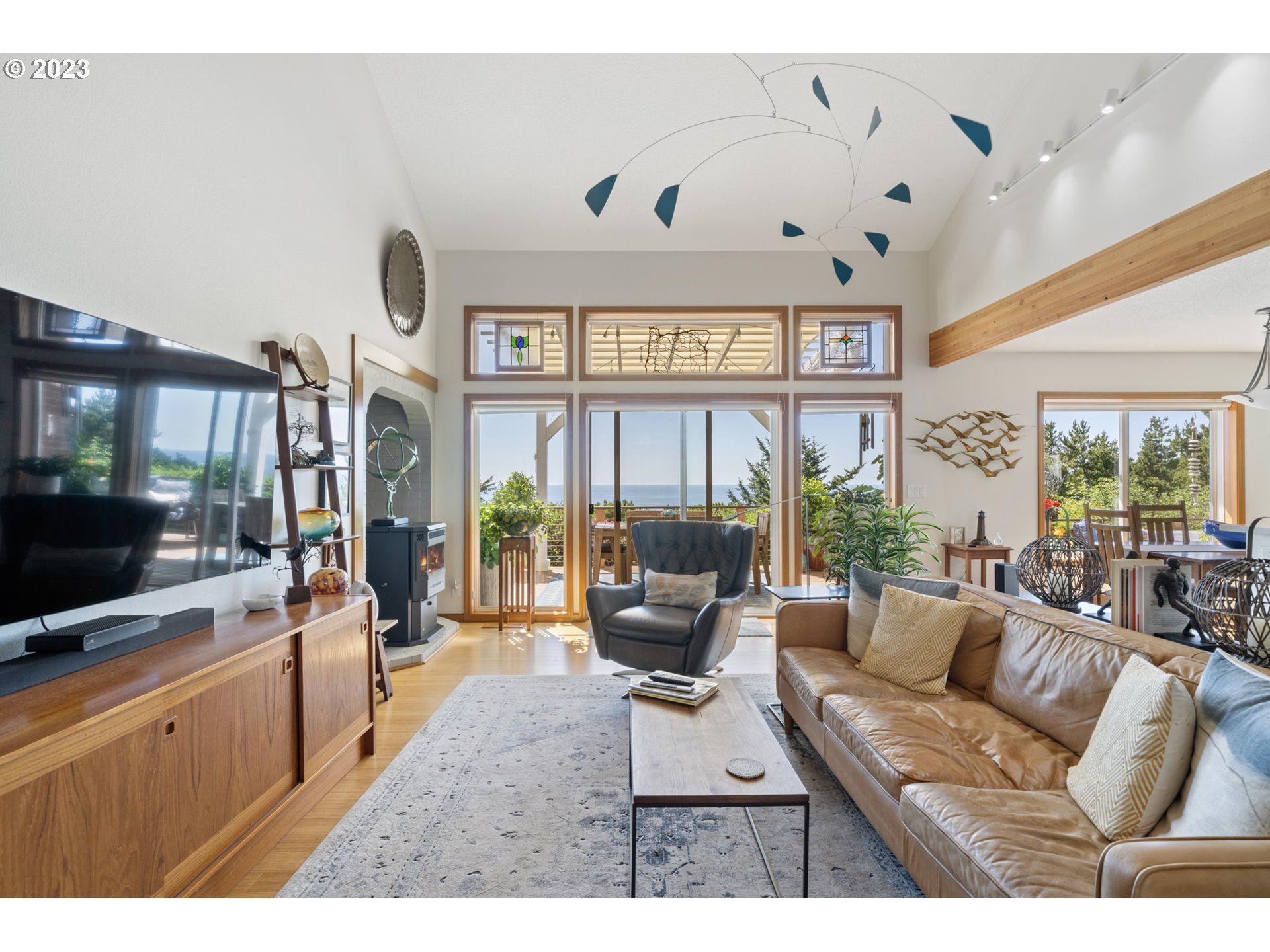 905 Pinewood West Tillamook, OR 97141 - Photo 6 of 44 a living room with furniture and a flat screen tv