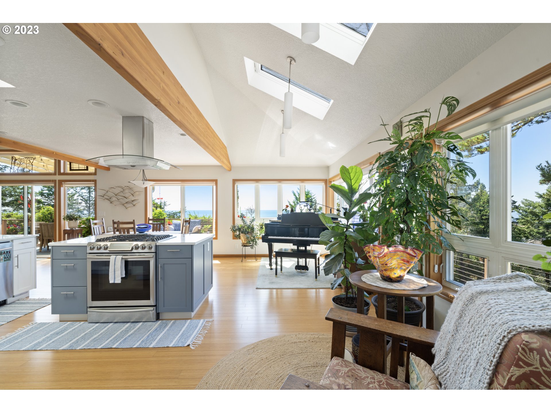 905 Pinewood West Tillamook, OR 97141 - Photo 9 of 44 a living room with a large window and a table
