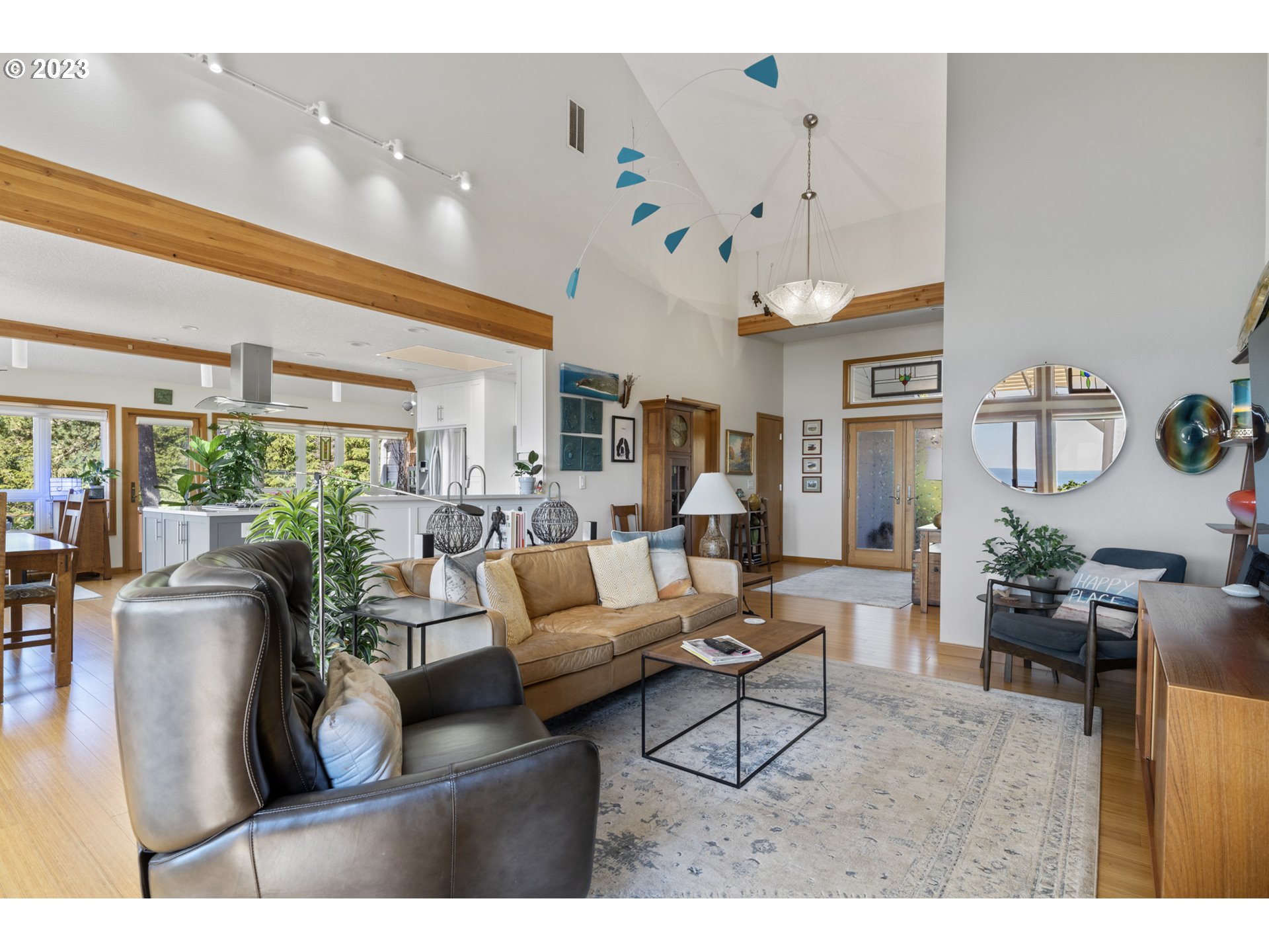 905 Pinewood West Tillamook, OR 97141 - Photo 10 of 44 a living room with lots of furniture and a large window