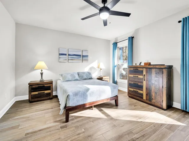 a view of a swimming pool with a patio and a garden