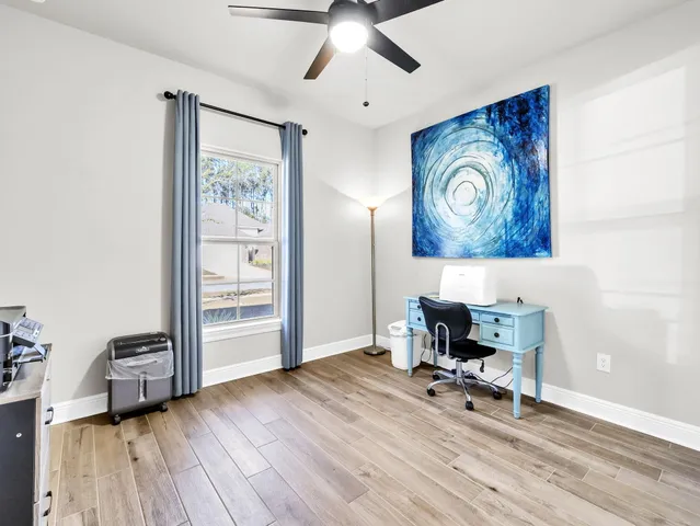 a view of a roof deck with table and chairs floor to ceiling window with wooden floor