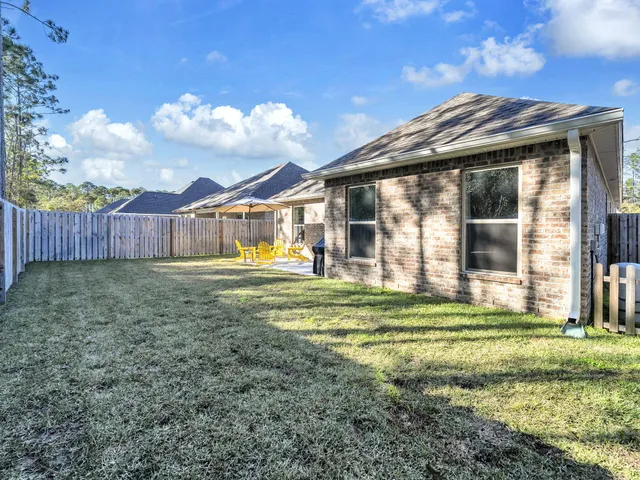 a view of a lake with a yard and mountain view