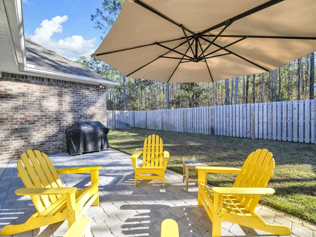 a view of a dining room with furniture wooden floor and chandelier
